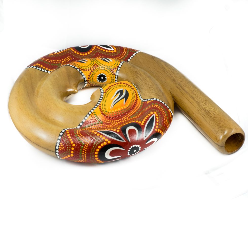 Travel didgeridoo in the shape of a spiral in red colour